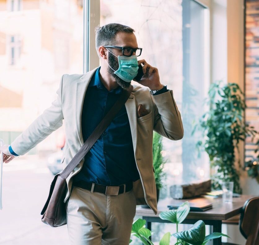 Businessman with protective mask during COVID-19